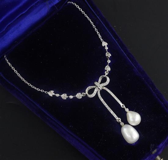 A Belle Epoque white metal natural saltwater pearl and diamond set double drop pendant necklace, 42cm.